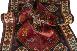 Corner detail of 2000s Shiraz rug showing border pattern and Wool pile