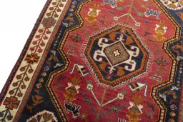 Backside of handmade 2000s Shiraz rug showing knot structure and weave density