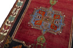 Backside of handmade 2000s Shiraz rug showing knot structure and weave density