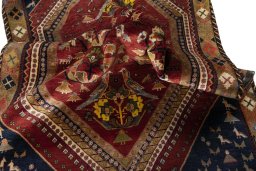 Corner detail of 2000s Shiraz rug showing border pattern and Wool pile