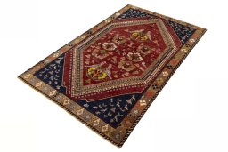 Corner detail of 2000s Shiraz rug showing border pattern and Wool pile