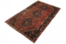 Corner detail of 2000s Shiraz rug showing border pattern and Wool pile