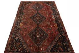 Surface texture of 2000s Shiraz rug with natural Wool and intricate pattern