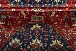 Corner detail of 2000s Shiraz rug showing border pattern and Wool pile