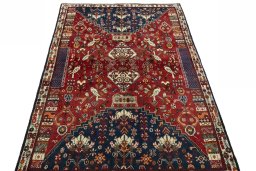 Surface texture of 2000s Shiraz rug with natural Wool and intricate pattern
