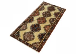 Corner detail of 2000s Shiraz rug showing border pattern and Wool pile
