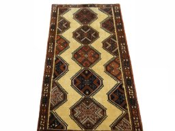 Surface texture of 2000s Shiraz rug with natural Wool and intricate pattern