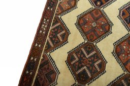 Backside of handmade 2000s Shiraz rug showing knot structure and weave density