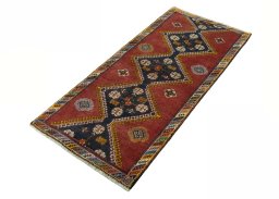 Corner detail of 2000s Shiraz rug showing border pattern and Wool pile