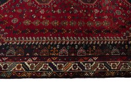 Corner detail of 2000s Shiraz rug showing border pattern and Wool pile