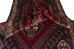 Surface texture of 2000s Shiraz rug with natural Wool and intricate pattern