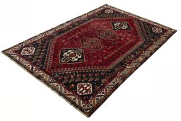 Corner detail of 2000s Shiraz rug showing border pattern and Wool pile
