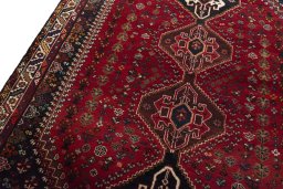 Backside of handmade 2000s Shiraz rug showing knot structure and weave density