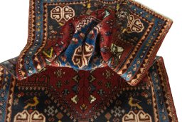 Corner detail of 2000s Shiraz rug showing border pattern and Wool pile