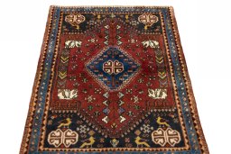 Surface texture of 2000s Shiraz rug with natural Wool and intricate pattern