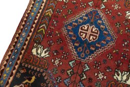 Backside of handmade 2000s Shiraz rug showing knot structure and weave density