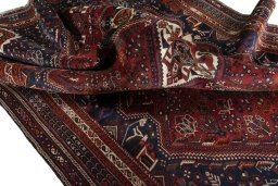 Corner detail of 2000s Shiraz rug showing border pattern and Wool pile