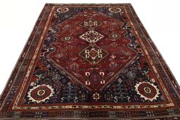 Surface texture of 2000s Shiraz rug with natural Wool and intricate pattern