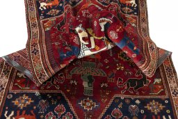 Corner detail of 2000s Shiraz rug showing border pattern and Wool pile