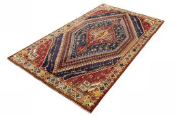 Corner detail of 2000s Shiraz rug showing border pattern and Wool pile