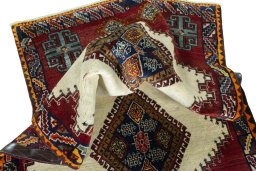 Corner detail of 2000s Shiraz rug showing border pattern and Wool pile