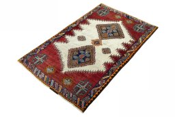Corner detail of 2000s Shiraz rug showing border pattern and Wool pile