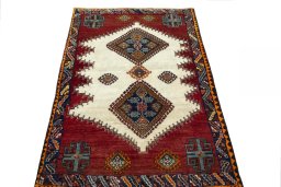 Surface texture of 2000s Shiraz rug with natural Wool and intricate pattern