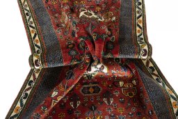 Corner detail of 2000s Shiraz rug showing border pattern and Wool pile
