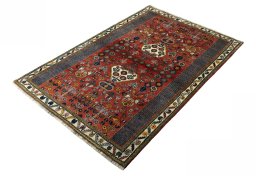 Corner detail of 2000s Shiraz rug showing border pattern and Wool pile