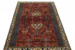 Surface texture of 2000s Shiraz rug with natural Wool and intricate pattern