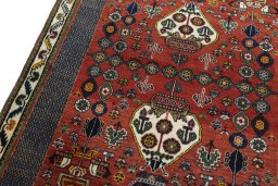 Backside of handmade 2000s Shiraz rug showing knot structure and weave density