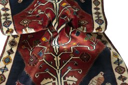 Corner detail of 2000s Shiraz rug showing border pattern and Wool pile