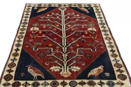 Surface texture of 2000s Shiraz rug with natural Wool and intricate pattern