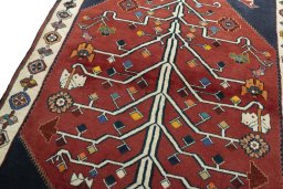 Backside of handmade 2000s Shiraz rug showing knot structure and weave density