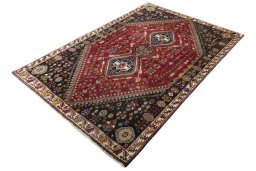 Corner detail of 2000s Shiraz rug showing border pattern and Wool pile