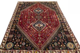 Surface texture of 2000s Shiraz rug with natural Wool and intricate pattern