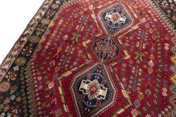Backside of handmade 2000s Shiraz rug showing knot structure and weave density