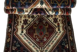 Corner detail of 2000s Shiraz rug showing border pattern and Wool pile