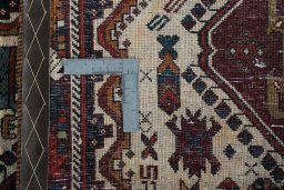 Surface texture of 2000s Shiraz rug with natural Wool and intricate pattern