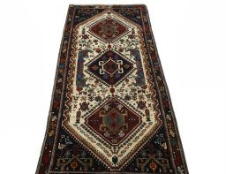 Surface texture of 2000s Shiraz rug with natural Wool and intricate pattern