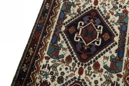 Backside of handmade 2000s Shiraz rug showing knot structure and weave density
