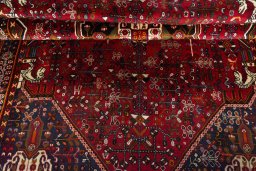 Corner detail of 2000s Shiraz rug showing border pattern and Wool pile
