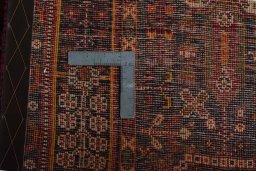 Surface texture of 2000s Shiraz rug with natural Wool and intricate pattern