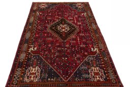Surface texture of 2000s Shiraz rug with natural Wool and intricate pattern