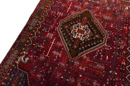 Backside of handmade 2000s Shiraz rug showing knot structure and weave density