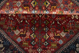 Corner detail of 2000s Shiraz rug showing border pattern and Wool pile