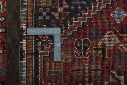 Surface texture of 2000s Shiraz rug with natural Wool and intricate pattern