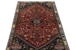 Surface texture of 2000s Shiraz rug with natural Wool and intricate pattern