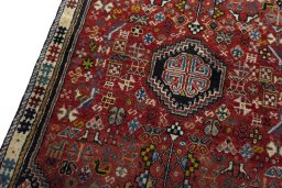 Backside of handmade 2000s Shiraz rug showing knot structure and weave density