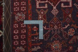 Surface texture of 2000s Shiraz rug with natural Wool and intricate pattern